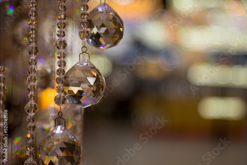 Beautiful crystal chandeliers warm light reflecting through brushed czech glass crystals hanging