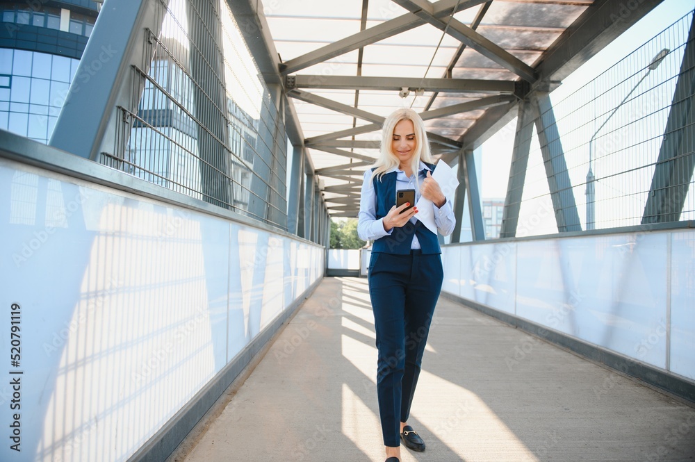 Portrait of a business woman using a cell phone