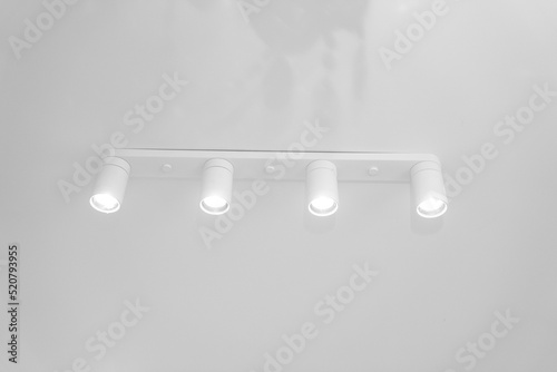 modern ceiling lamp on a stretch ceiling. interior. © andrey