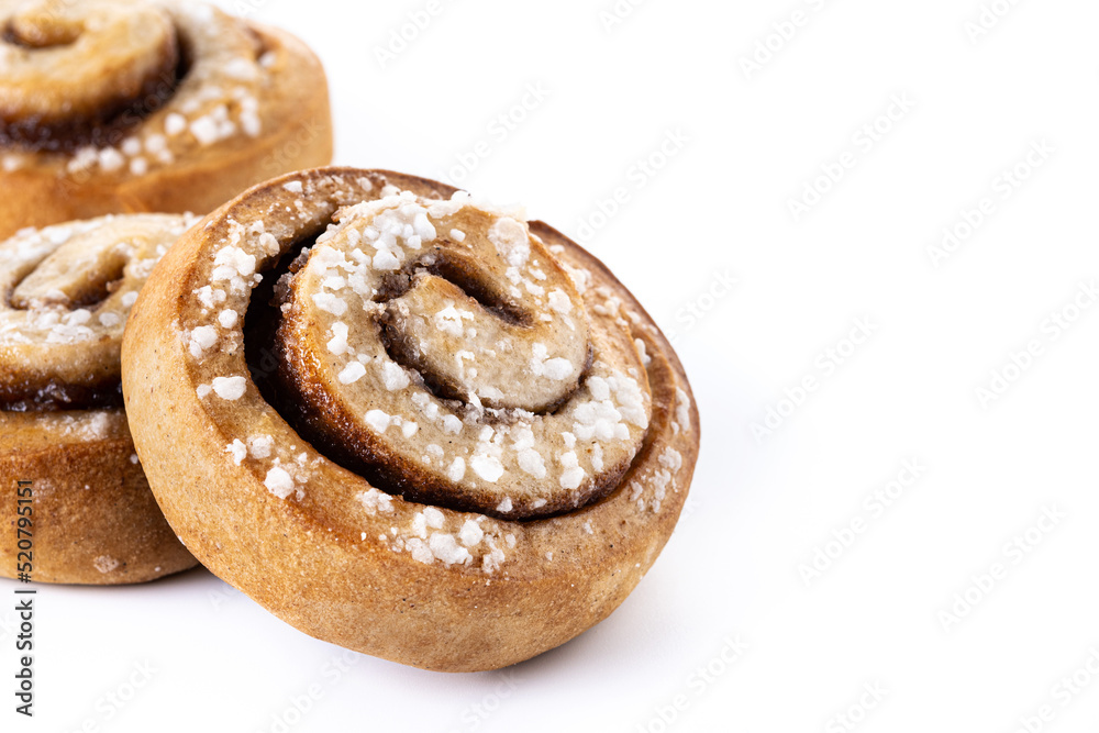 Cinnamon rolls buns. Kanelbulle Swedish dessert isolated on white background. Copy space Cinnamon rolls buns. Kanelbulle Swedish dessert isolated on white background. Copy space