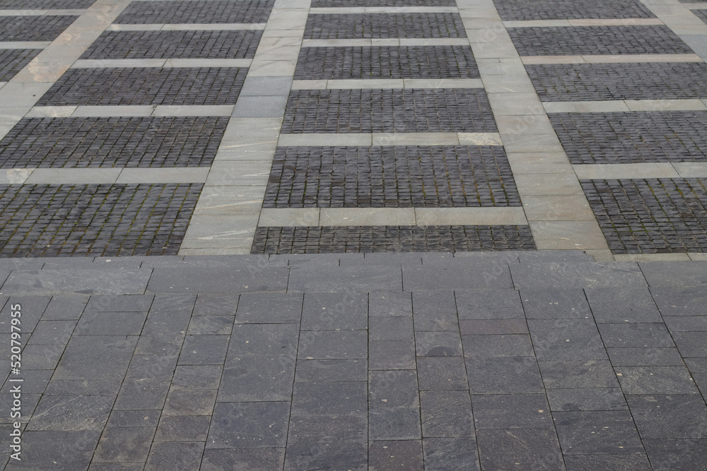 Abstract background. modern cobblestone pavement. Sidewalk made of gray stones