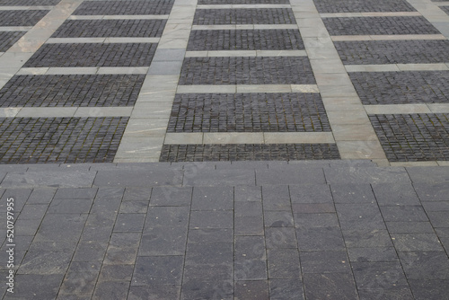 Abstract background. modern cobblestone pavement. Sidewalk made of gray stones