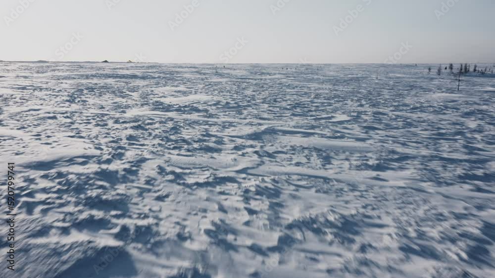 Beautiful winter Siberian landscape from a copter. The snowy valley glistens in the sun. Beautiful winter Siberian landscape from a copter. The snowy valley glistens in the sun.