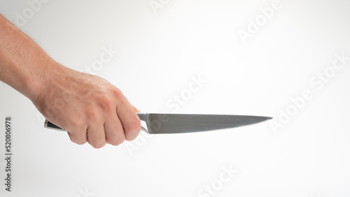 A man's right hand holds a kitchen knife gesture