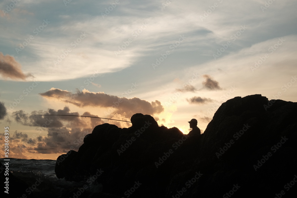 silhouette of a person at sunset