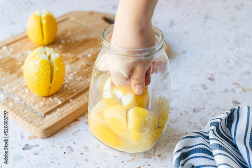 Quadro em tela Making preserved Moroccan lemon with lemons and salt