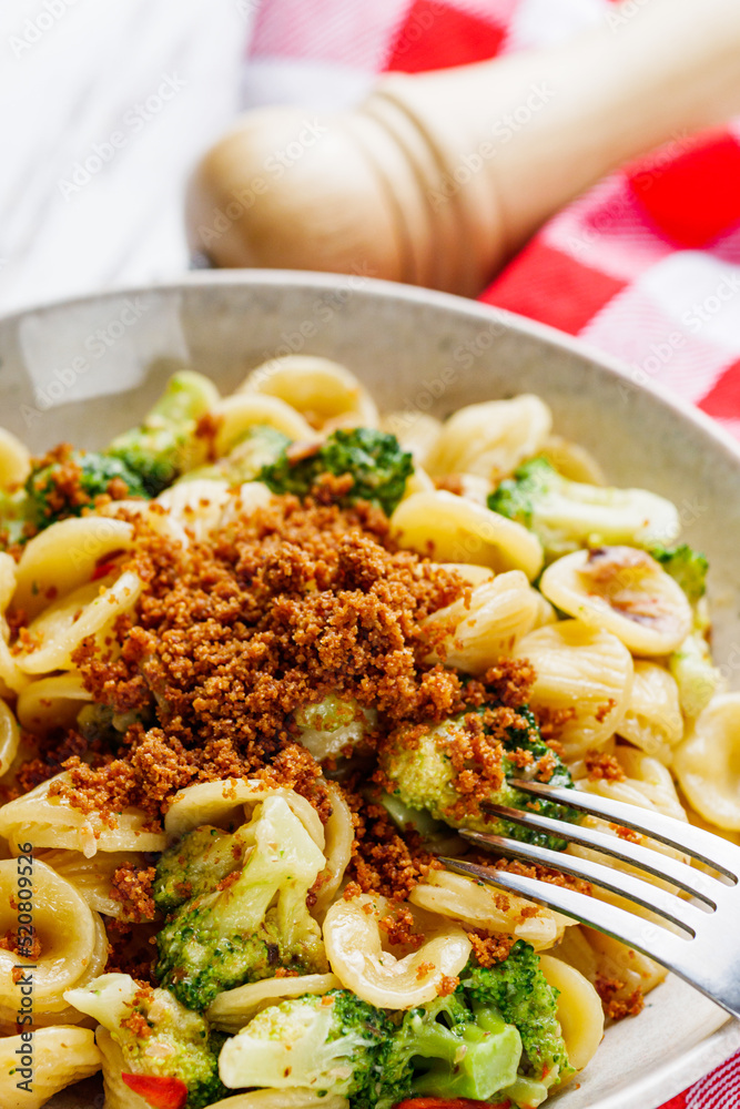 orequette pasta with broccoli on a white background orequette pasta with broccoli on a white background