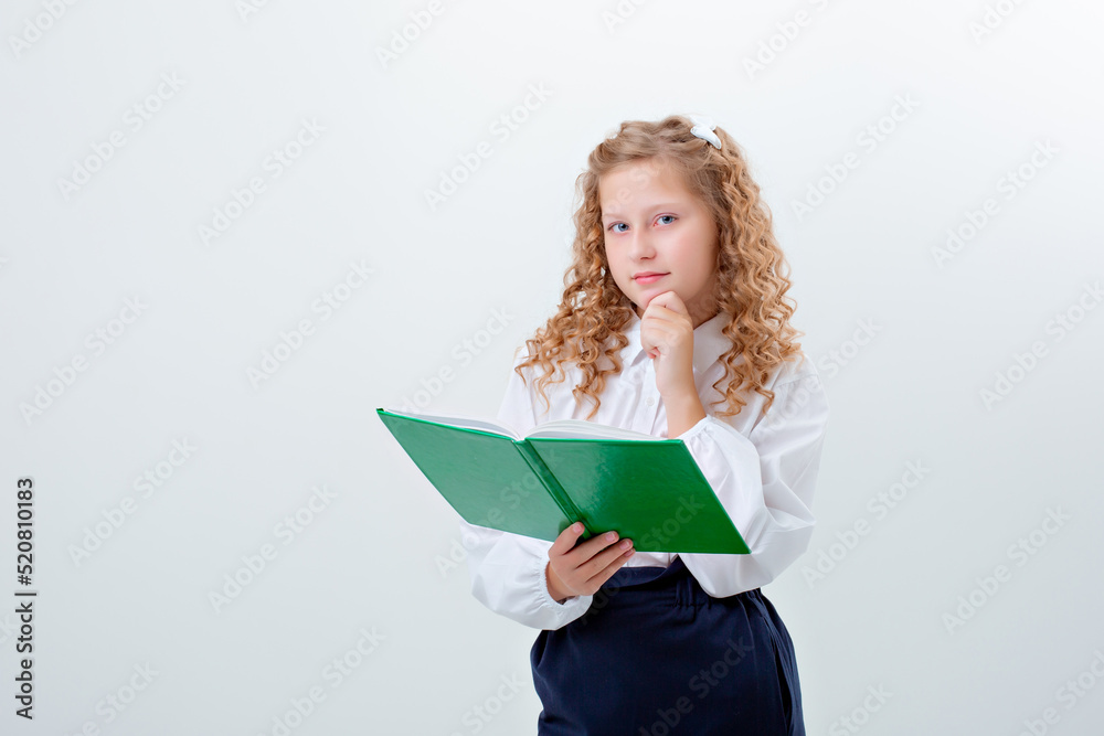 schoolgirl teenage girl in school uniform holding a book on a white background schoolgirl teenage girl in school uniform holding a book on a white background
