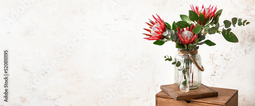 Vase with bouquet of protea...