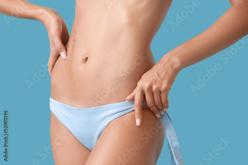 Young tanned woman in swims...