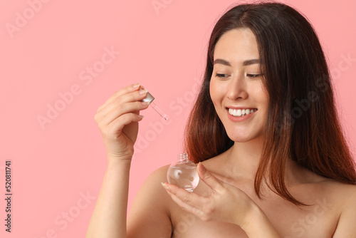 Young Asian woman with cosm...