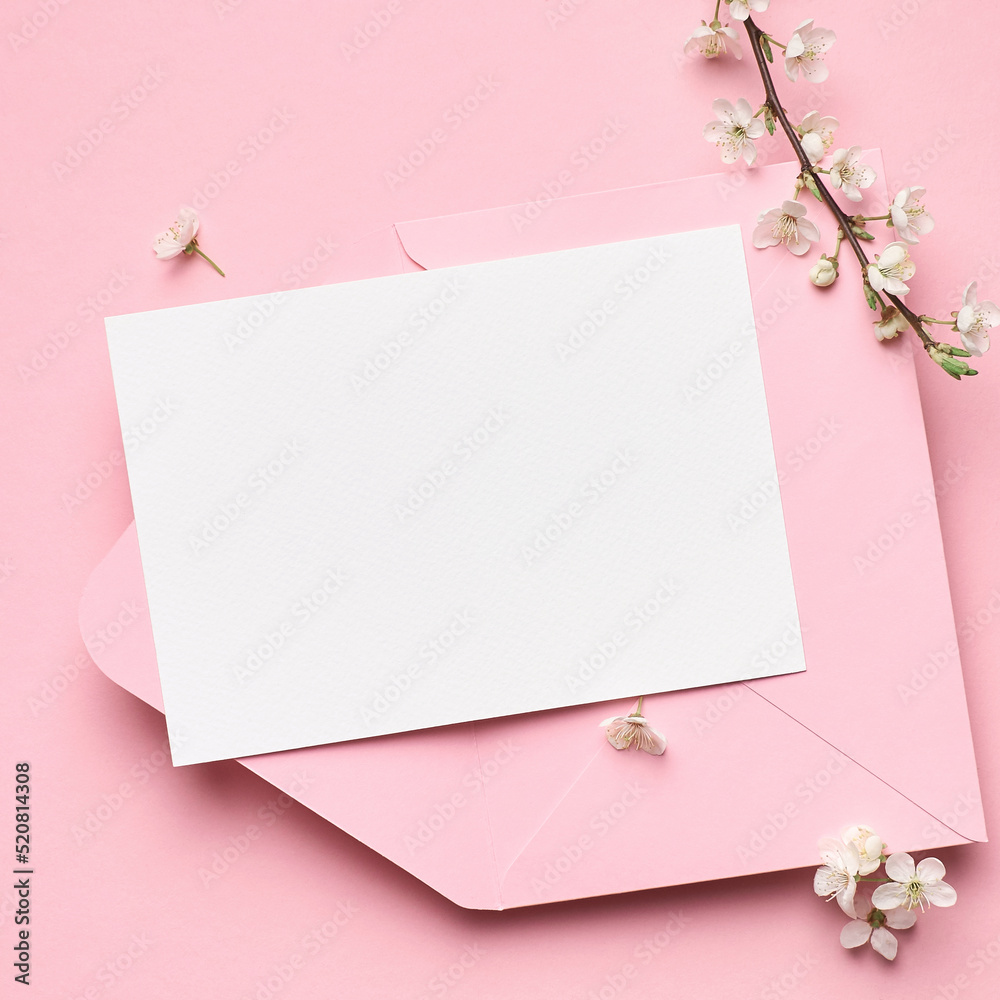 Greeting card mockup with white flowers on pink background Greeting card mockup with white flowers on pink background