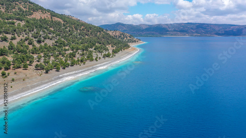 Blue waters and volcanic peebles of magical Salda Lake in Burdur  Turkey.