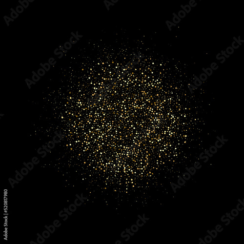 A circle of gold dust with many small particles of different scales on a black background. Gold glitters.