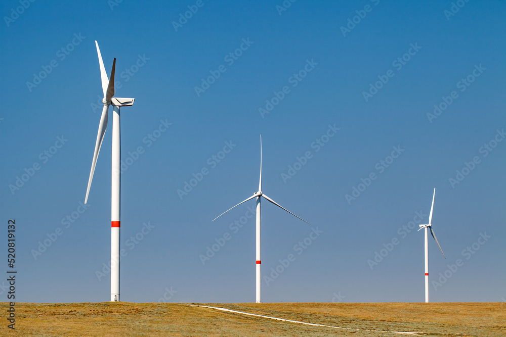 Wind generators, wind farms, wind turbines, power generation. The concept of green energy.