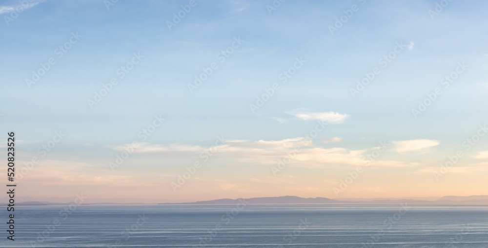 Panoramic View of Cloudscape during a colorful sunset or sunrise. Taken on the West Coast of British Columbia, Canada.