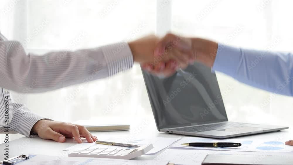 Handshake. Business partners shake hands after negotiating a joint business project planning agreement. Handshake. Business partners shake hands after negotiating a joint business project planning agreement.