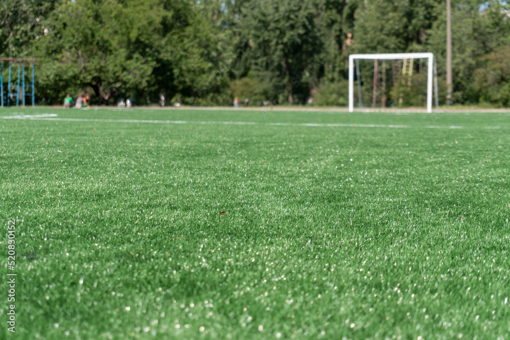 Fototapeta premium Marking on a modern stadium with artificial turf. School stadium.