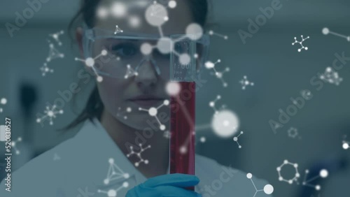 Animation of molecules over caucasian scientist in lab photo