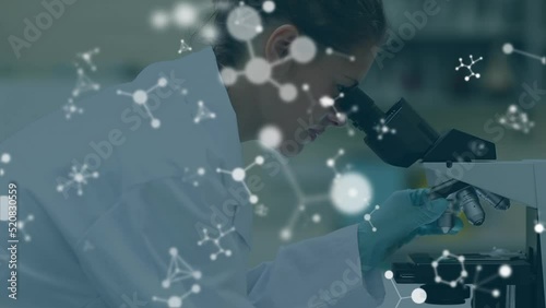 Animation of molecules over caucasian scientist in lab photo