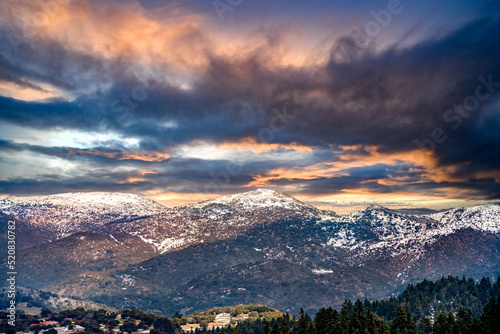 view of snow coated Helmos mountain which located in Peloponnese. Grecce.The photo taken from the opposite mountain named Mainalo
