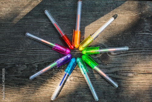 Color wheel of gel pens on table outside