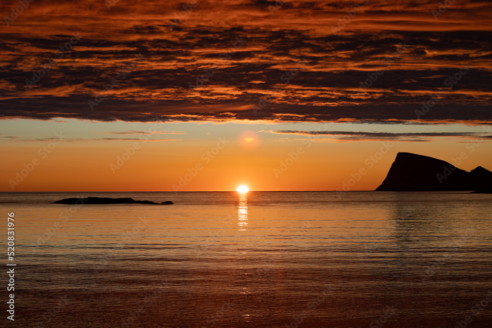 beautiful atmosphere of midnight sun at Sommaroy island (Sommarøy) with Haja (Håja) island in the background, Tromso Norway beautiful atmosphere of midnight sun at Sommaroy island (Sommarøy) with Haja (Håja) island in the background, Tromso Norway