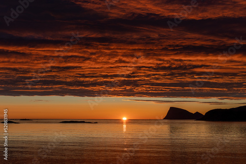 beautiful atmosphere of midnight sun at Sommaroy island  Sommar  y  with Haja  H  ja  island in the background  Tromso Norway