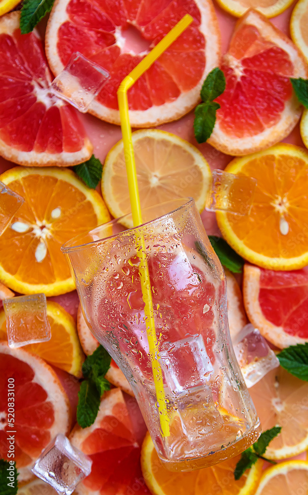glass of cocktail with citruses. Selective focus. glass of cocktail with citruses. Selective focus.