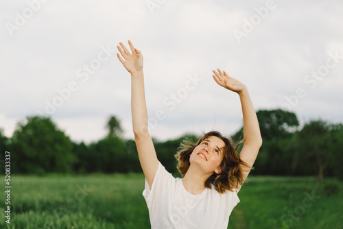 Portrait Of Teenager Girl. Happy Cheerful Teen Girl With Pronounced Face dancing In Outdoors.