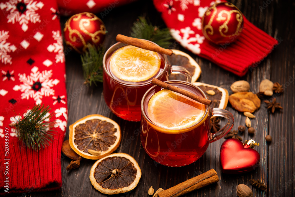 Fruity mulled wine on a wooden background with spices. Fruity mulled wine on a wooden background with spices.