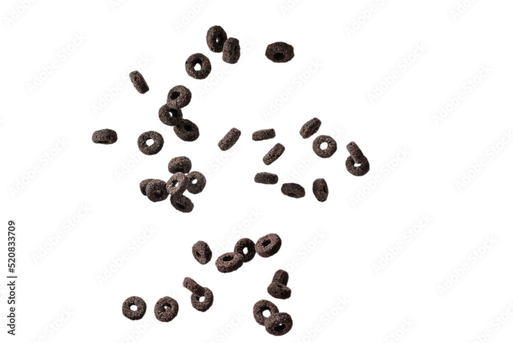 Chocolate rings cereal spill out into a bowl. Breakfast. Chocolate rings cereal spill out into a bowl. Breakfast.