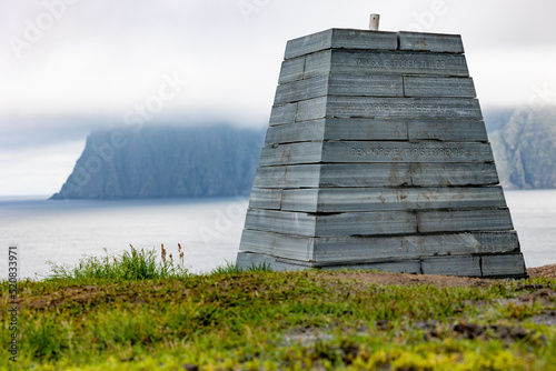 Knivskjellodden and North Cape (Nordkapp) on background on Mageroya Island, North Cape (Nordkapp), Finnmark, Norway photo