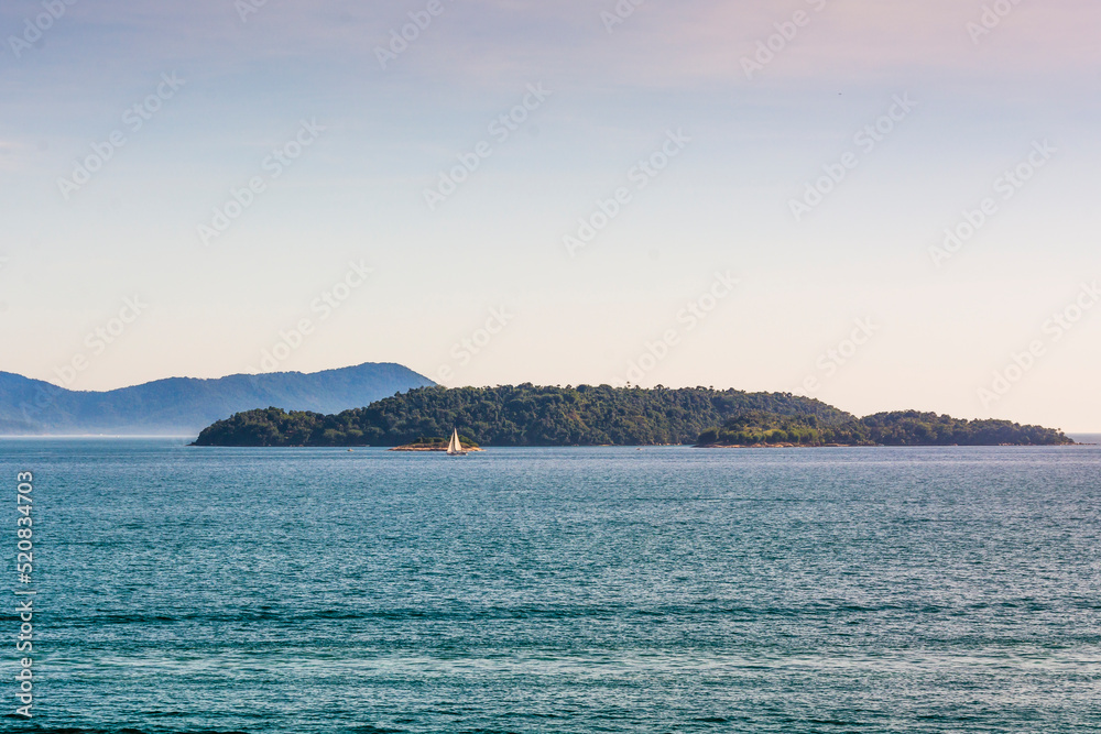 Seascape with a distant sailboat at Angra dos Reis town, State of Rio de Janeiro, Brazil. Taken with Nikon D7100 18-200lens, at 62mm, 1/160 f 11 ISO 100. Date: Dec  27, 2016