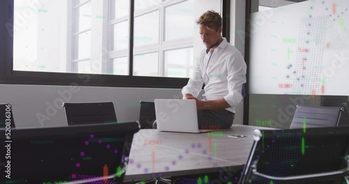 Animation of data processing over caucasian businessman in office photo