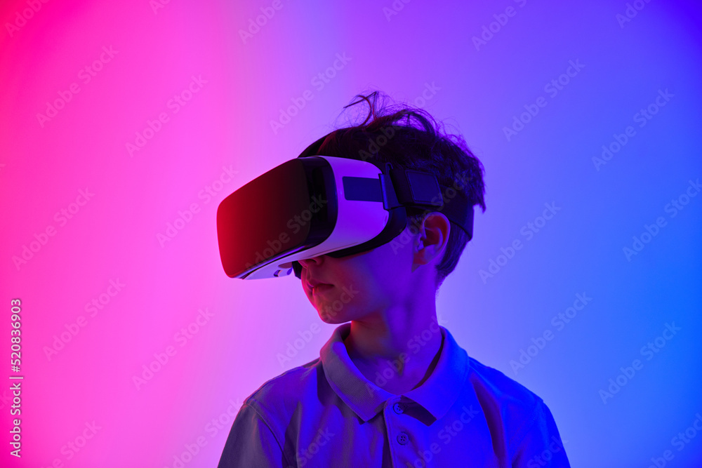 Child in glasses of virtual reality