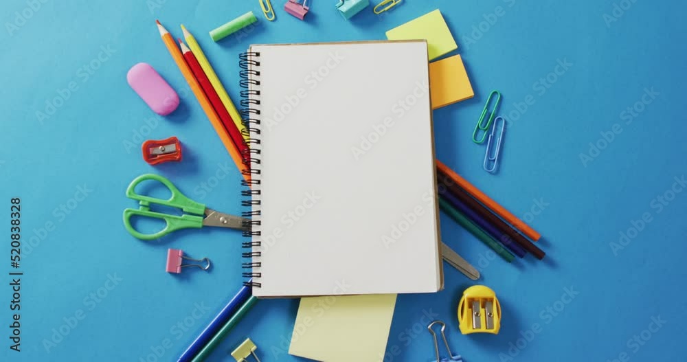 Video of notebook with copy space and school equipment on blue background Video of notebook with copy space and school equipment on blue background