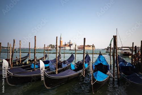 Venetian gondolas lined up in Venice Italy