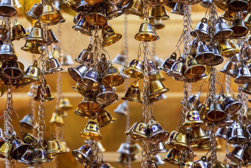 Gold and silver coloured bells decorate the Wat Phra Singh temple in Chiang Mai, Thailand.