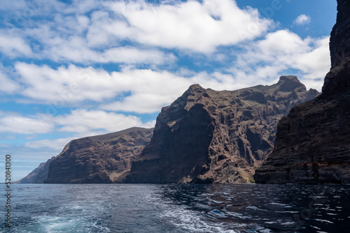 Panoramic view on the massive cliffs of Los Gigantes in Santiago del Teide  West coast Tenerife  Canary Islands  Spain  Europe. Rock formations along coastline of the Atlantic Ocean. Playa de Masca