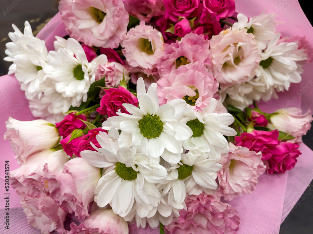 Beautiful big pink bouquet with pink roses and white chrysanthemums 