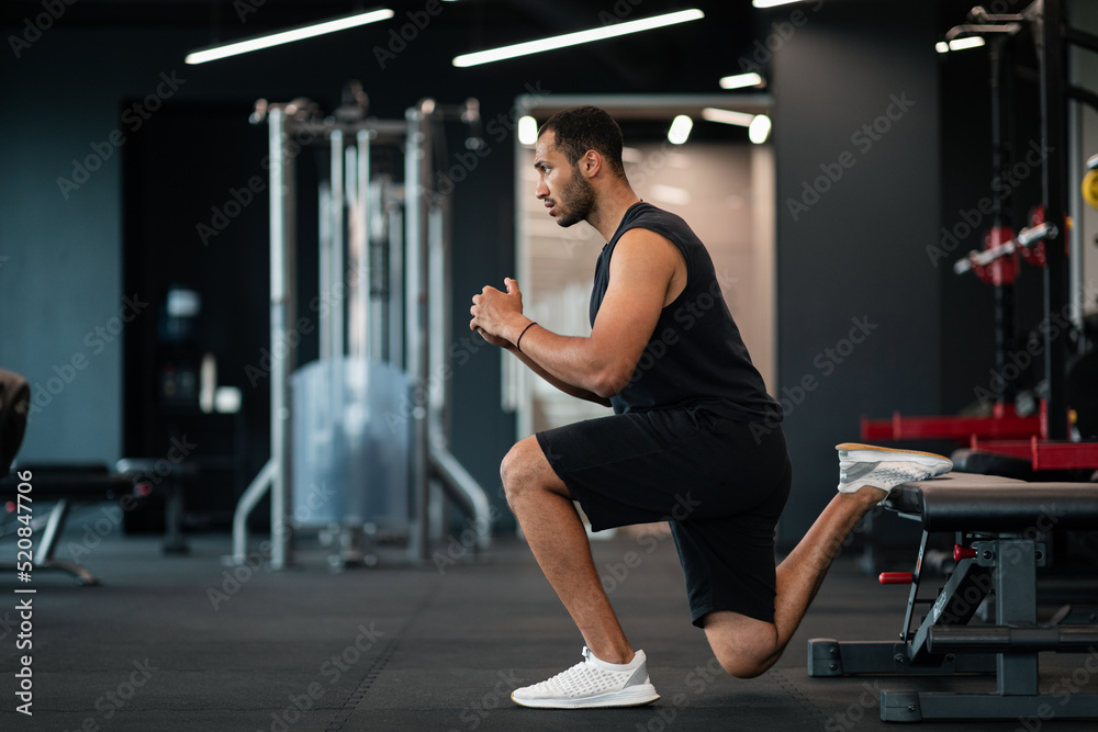Portrait Of Athletic Black Man Making Bulgarian Split Squat Exercise At Gym