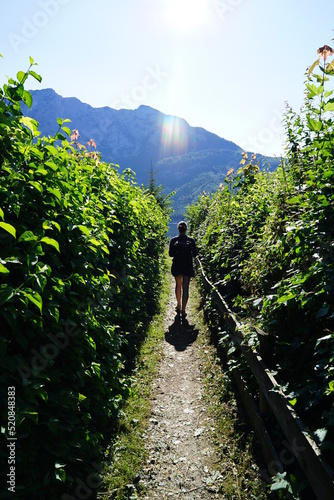 A woman walkingin the morning by the Austrian mountains