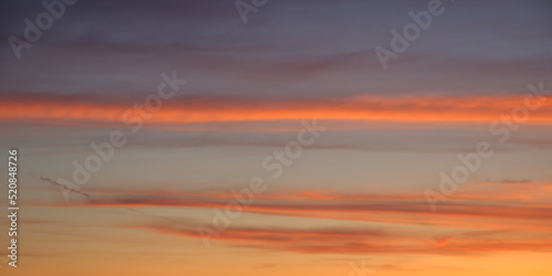 Fototapeta Naklejka Na Ścianę i Meble -  Bright sunset sky, full frame. Orange, pink, red clouds. The sky as a background.