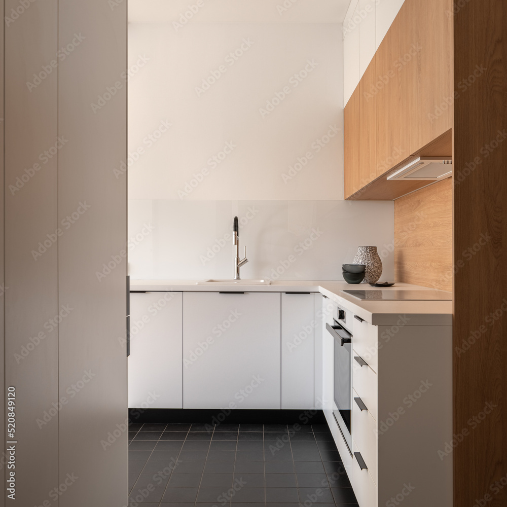 Simple kitchen in white and wood Simple kitchen in white and wood
