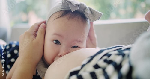 Close up portrait happiness people Asian family little baby girl sucking milk from mother, woman mom breastfeeding cute infant daughter care with love, motherhood childhood parenting kid at home