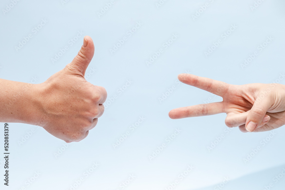 Two hands gesturing on a blue background Two hands gesturing on a blue background