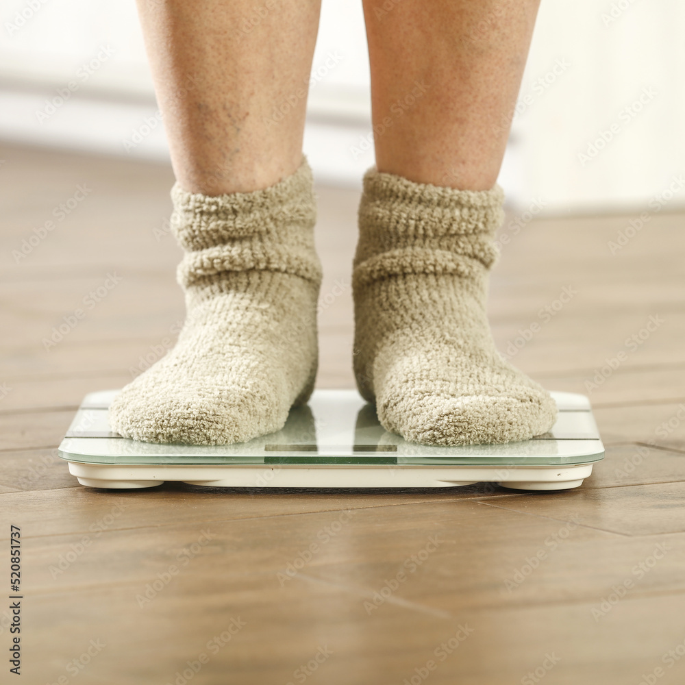 Woman legs with socks and foot weight. Free space for your decoration. Woman legs with socks and foot weight. Free space for your decoration.