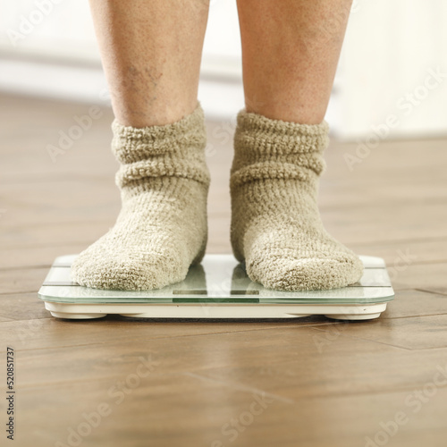 Woman legs with socks and foot weight. Free space for your decoration. 