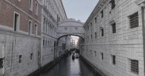 Gondola navigate in a small canal il Venice